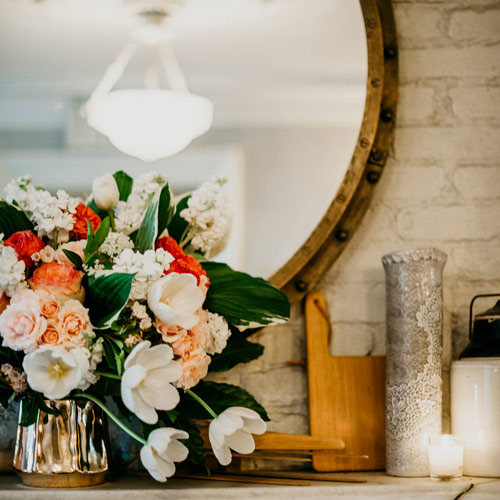 Flowers and candles create intimate wedding atmosphere at Maison May
