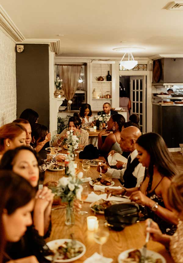 A communal table allows for intimate wedding dinner receptions.